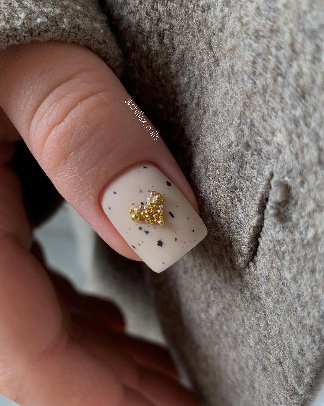 stylish fall gel nails ideas 2026 Cozy Neutral With A Golden Accent