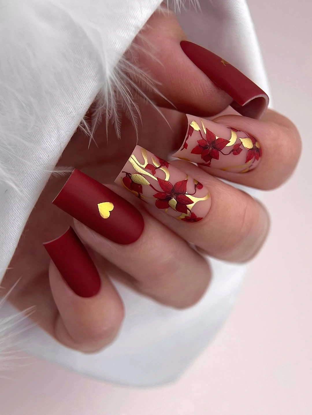 stylish fall gel nails ideas 2026 Deep Red Gel Nails With Floral Gold Accents