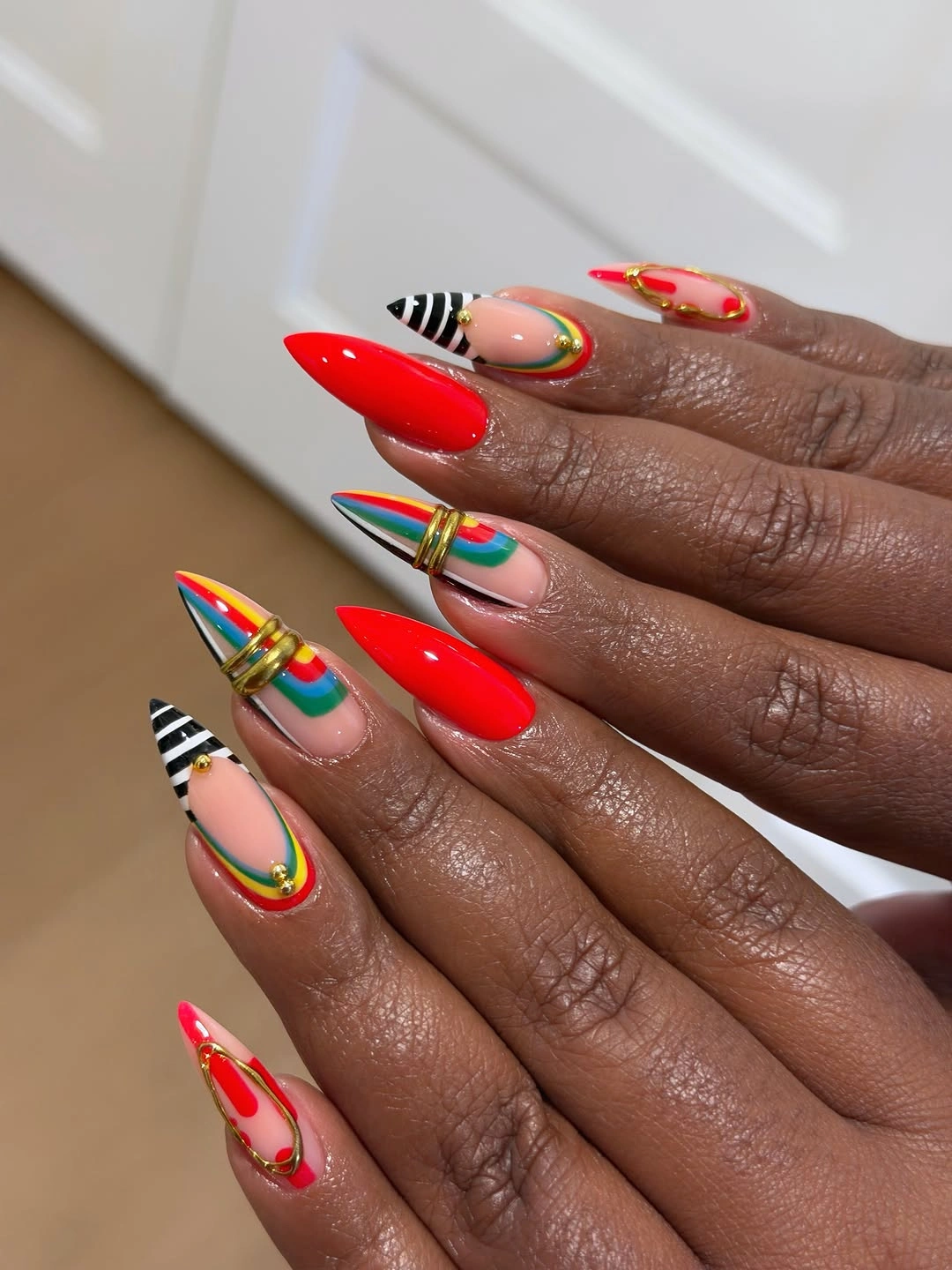 stylish fall nails for brown skin tone Cherry Red With Colorful Graphic Accents