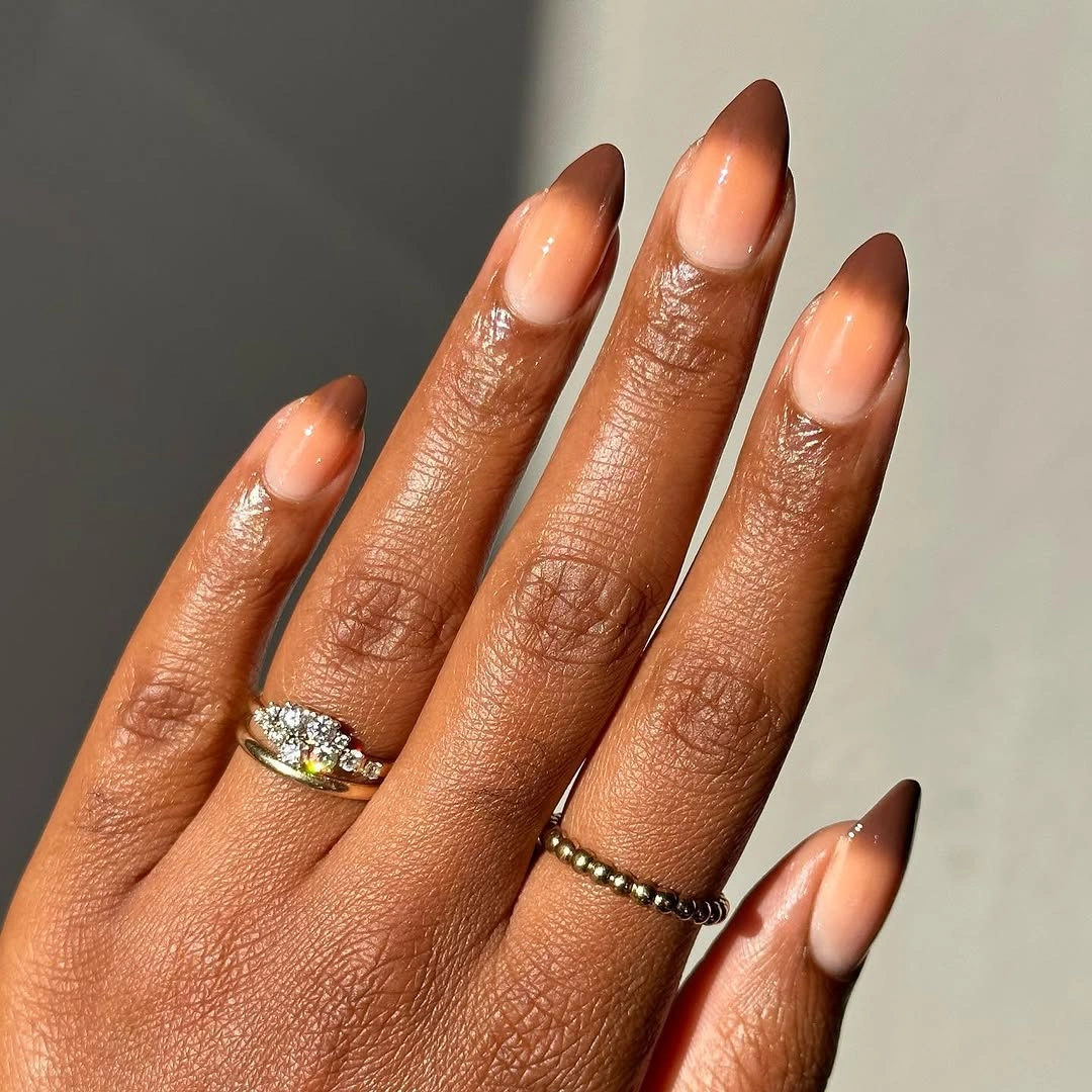 stylish fall nails for dark skin 2026 Warm Cinnamon Ombre Almond Nails