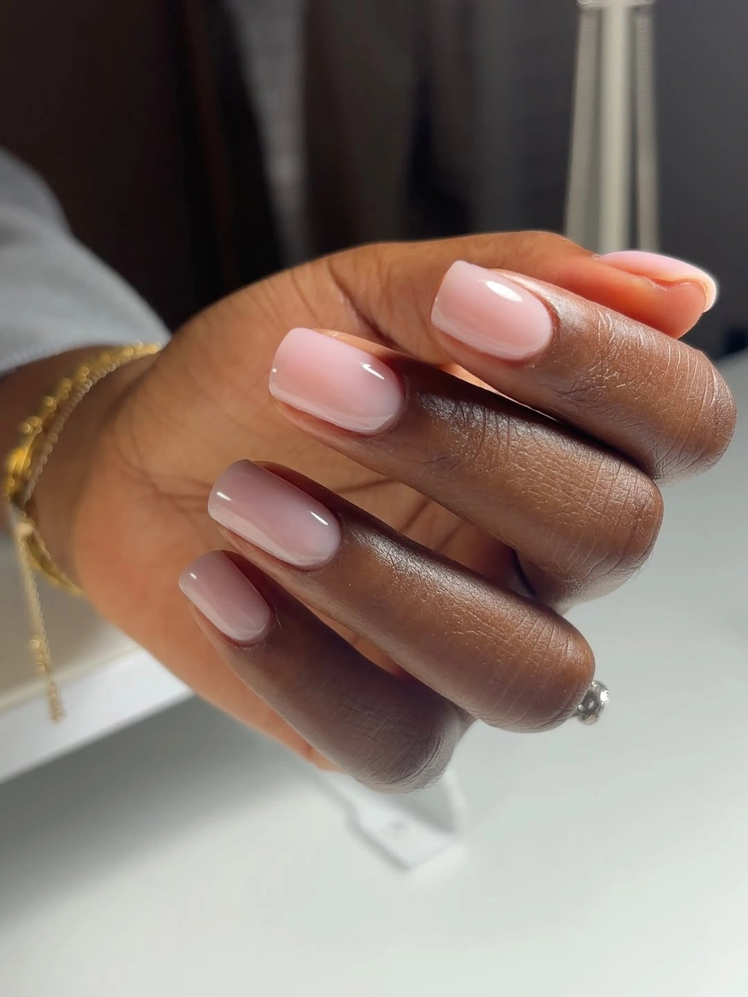 stylish fall nails for dark skin 2026 Glossy Milky Pink Perfection