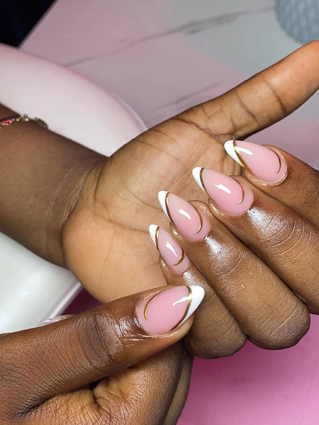 stylish fall nails for dark skin 2026 Elegant White French With Gold Lines