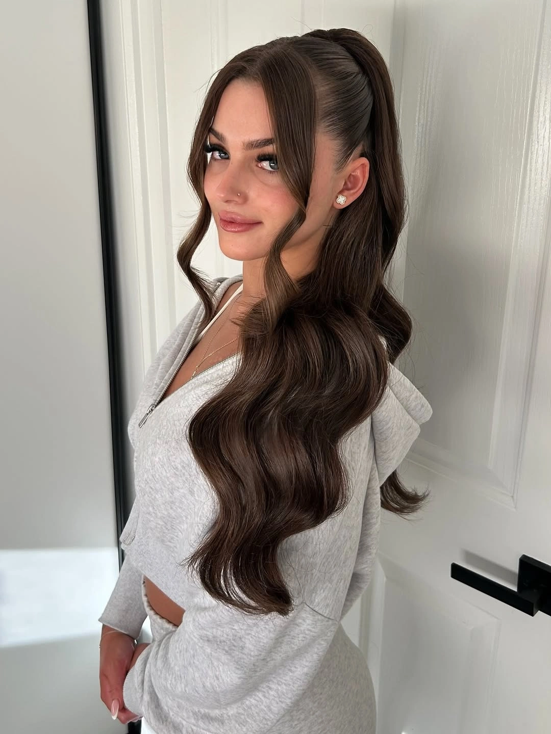 stylish middle parting hairstyles High Ponytail With Soft Face Framing Waves