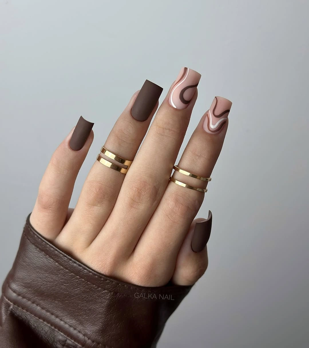 Trendy dark fall nails 2026 dark chocolate swirl nails