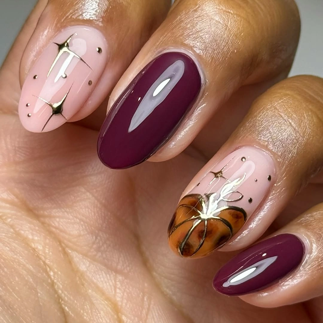 trendy fall burgundy nails with design Burgundy Nails With a Tiny Pumpkin Accent