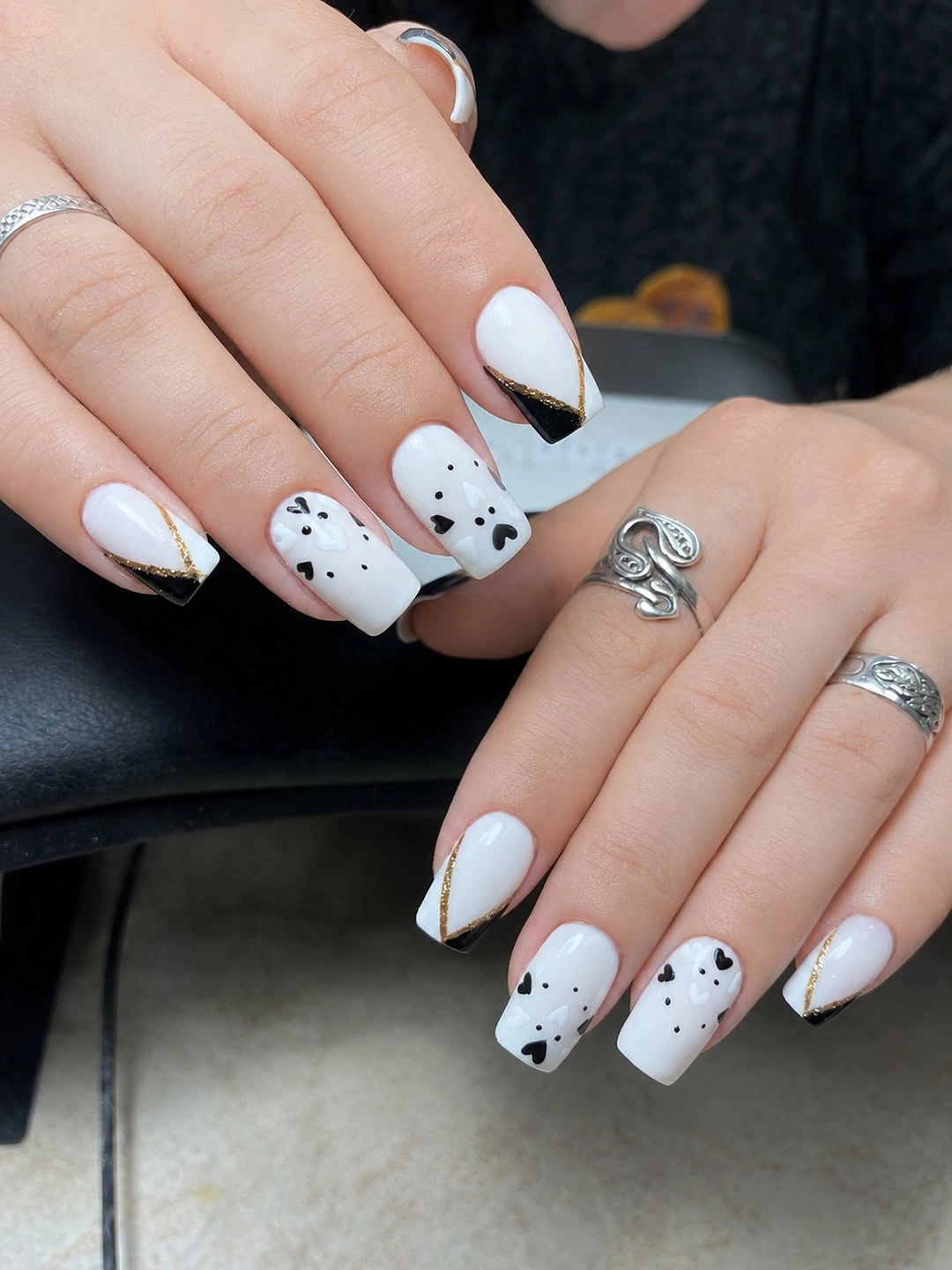 trendy fall nails for pale skin 2026 - White Black and Gold With a Little Autumn Drama