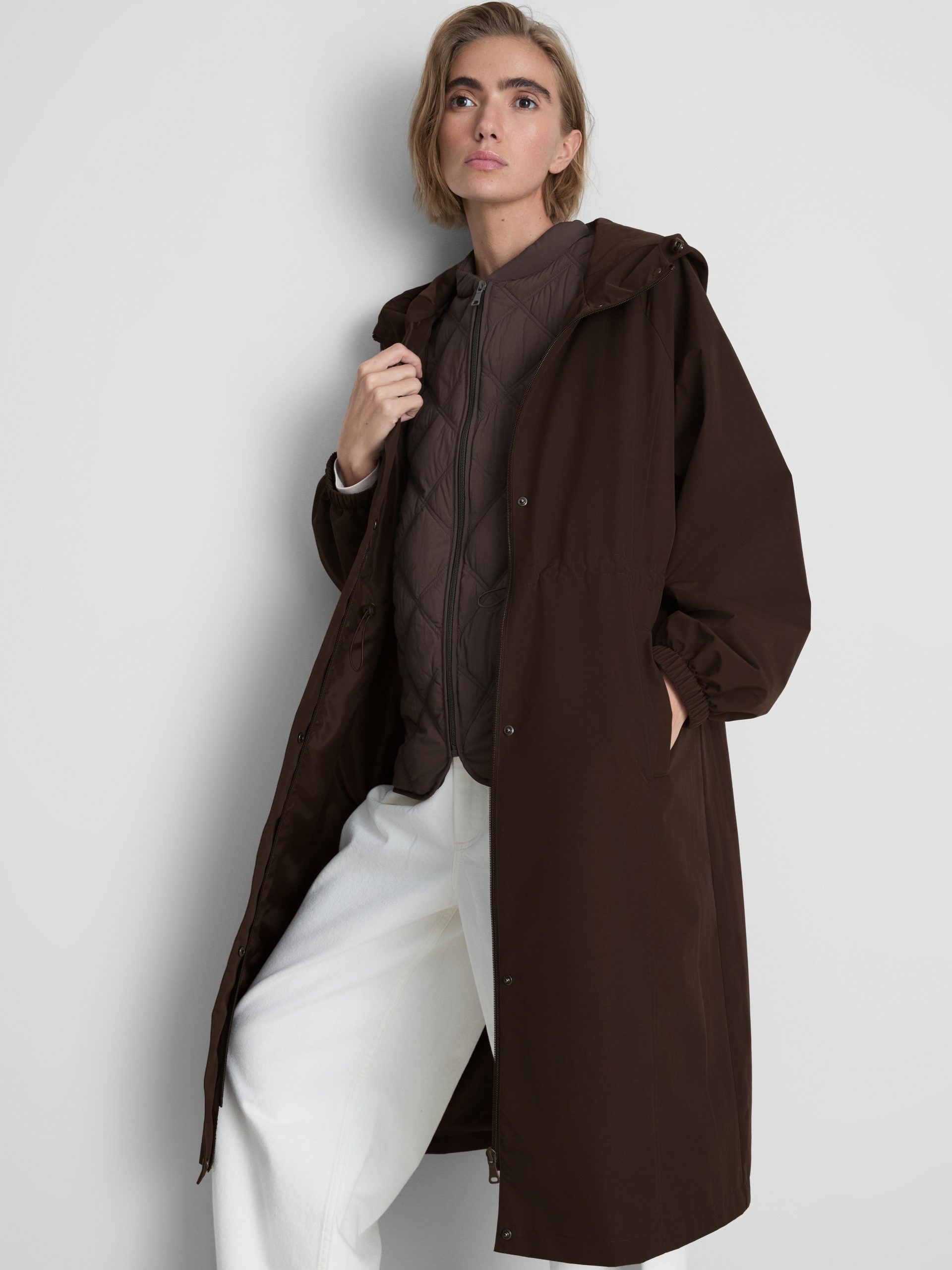 Layered Brown Parka with Quilted Vest and White Jeans Layered Brown Parka with Quilted Vest and White Jeans β Cold Weather Outfits
