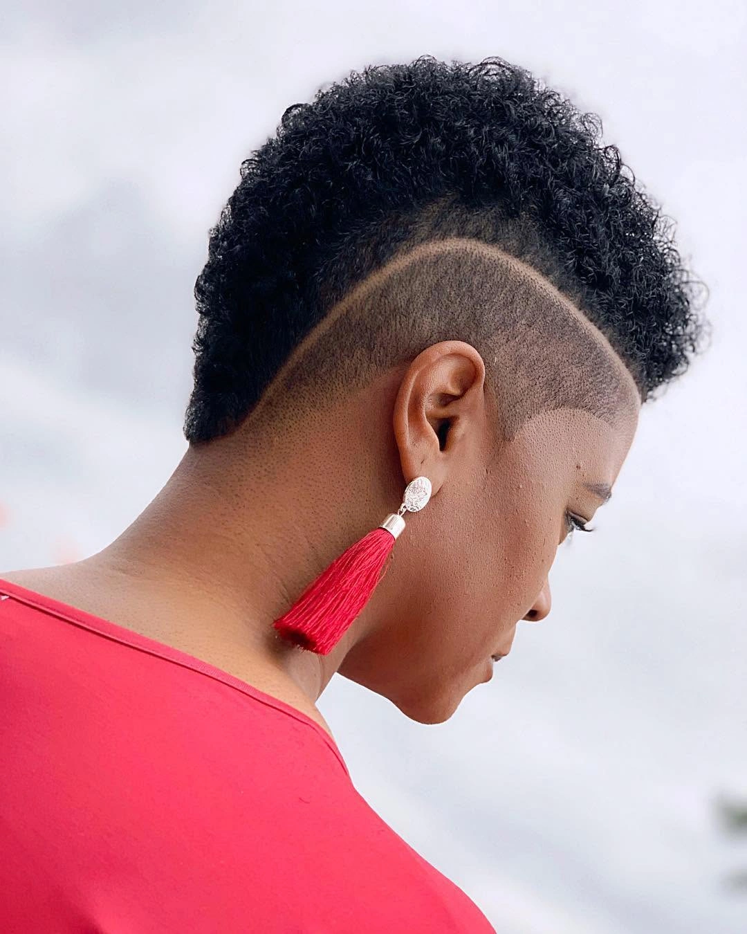 beautiful and trendy haircuts for black women 2027 Curly Sculpted Crop with Curved Side Design