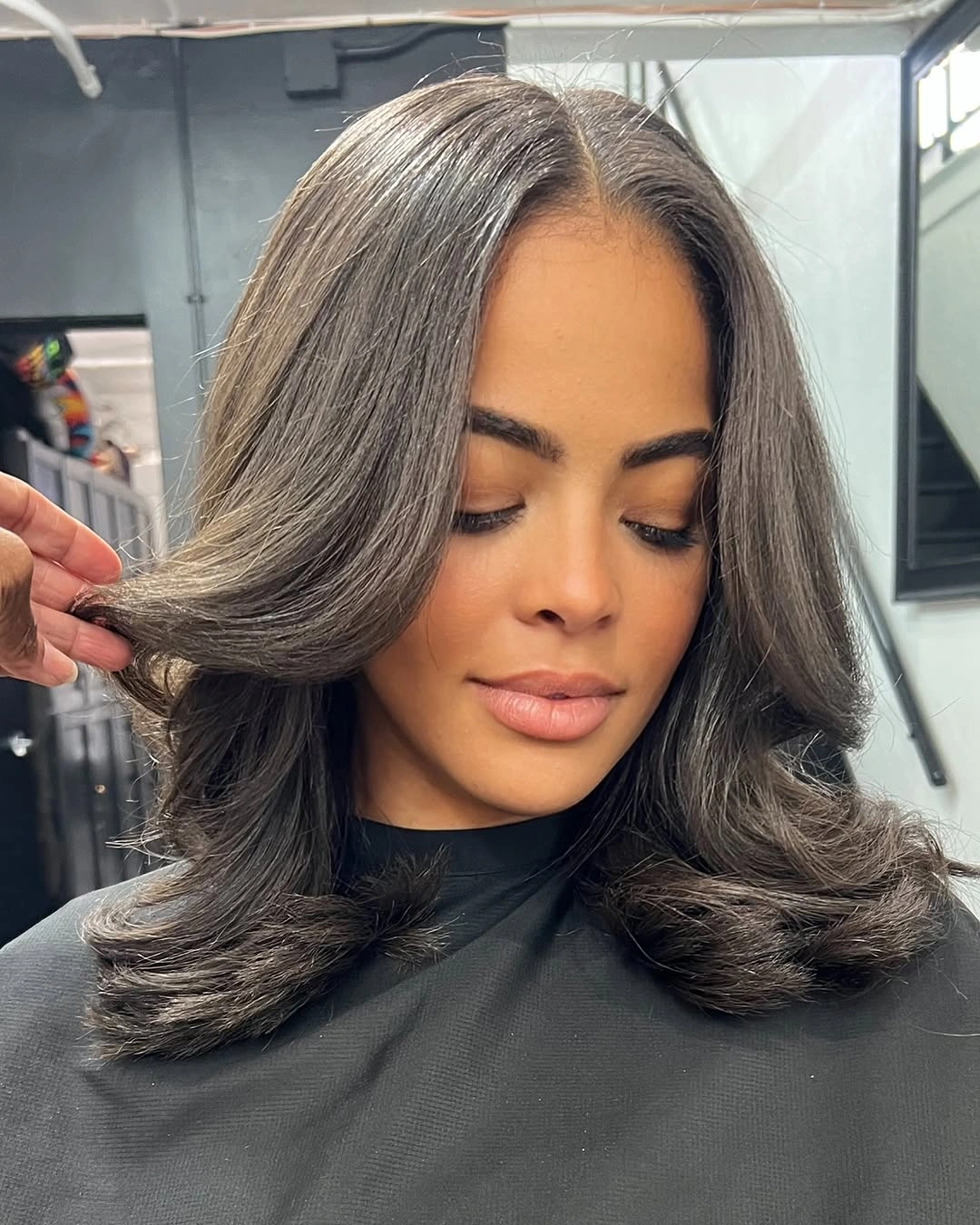 beautiful and trendy haircuts for black women 2027 Soft Layered Medium Cut with Silver Dimension