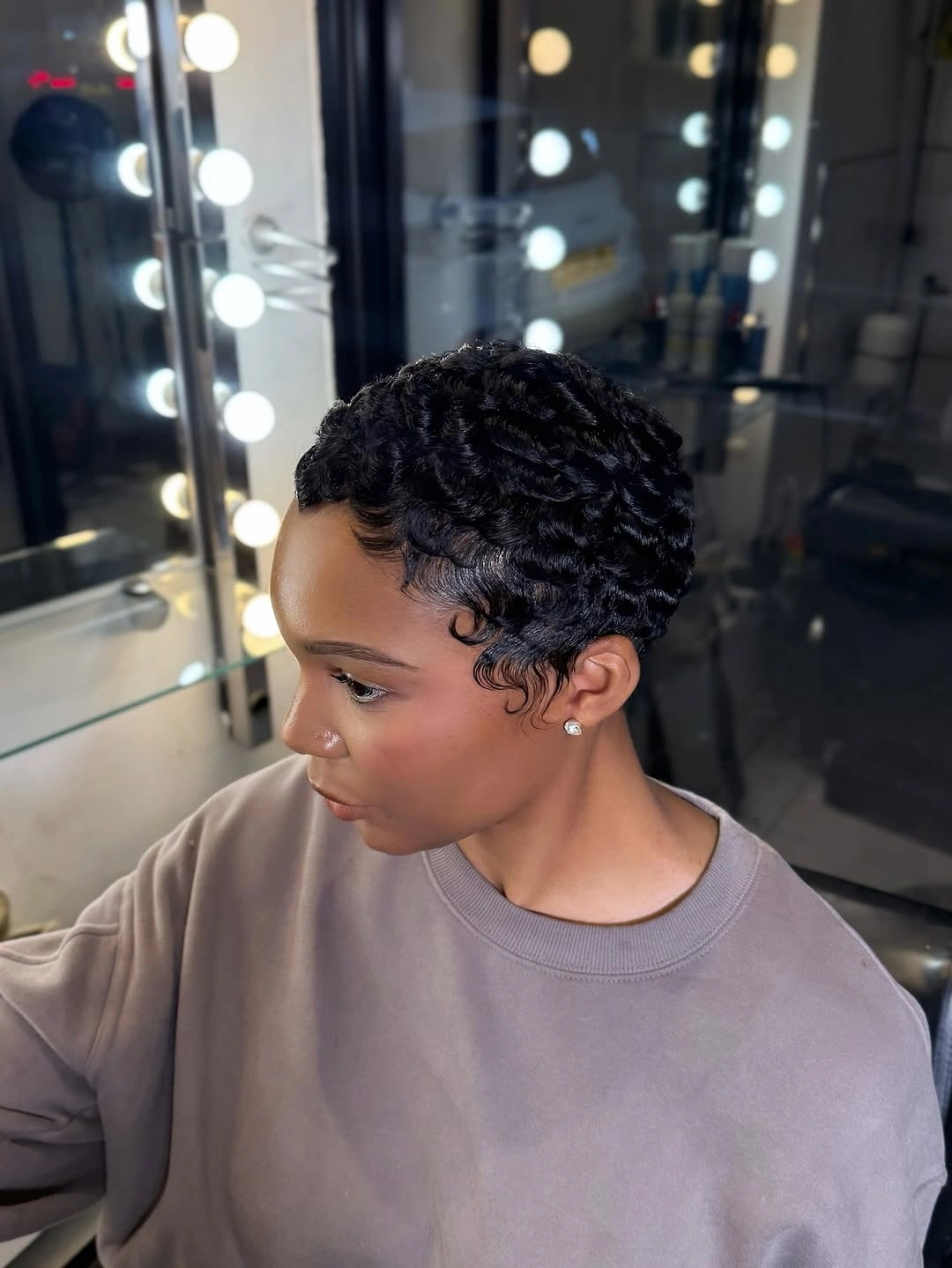 beautiful and trendy haircuts for black women 2027 Sculpted Finger Wave Pixie with Vintage Texture