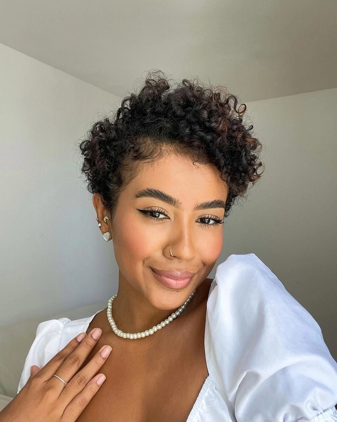 beautiful and trendy haircuts for black women 2027 Curly Pixie with Romantic Volume
