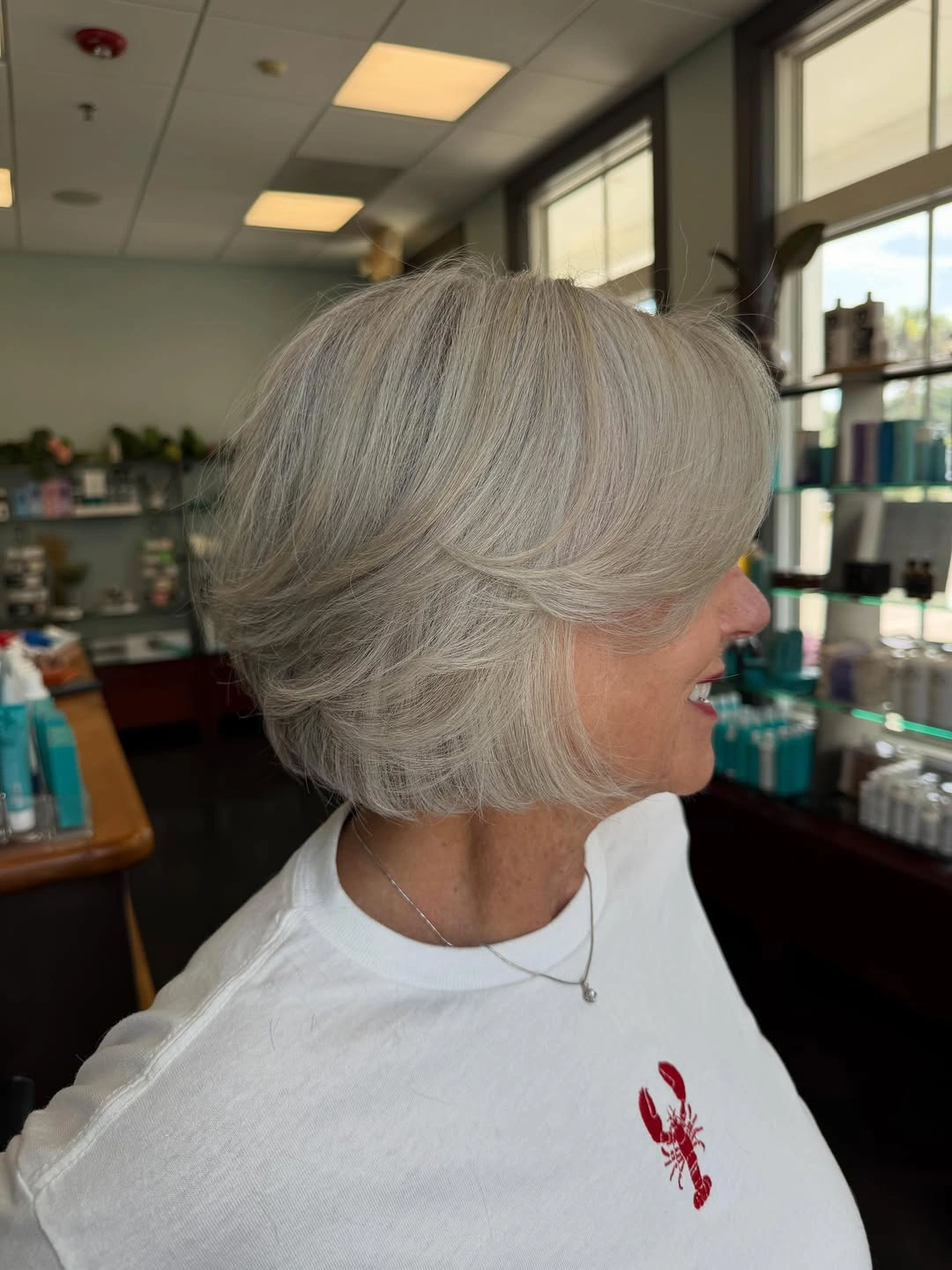 beautiful and trendy haircuts for women over 50 2027 Soft Silver Layers With a Polished Bob Shape
