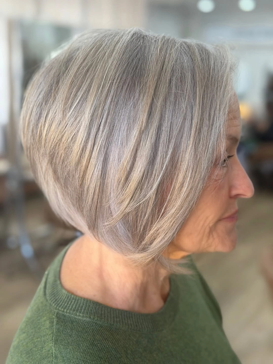 beautiful and trendy haircuts for women over 50 2027 Rounded Silver Bob With Feathered Layers