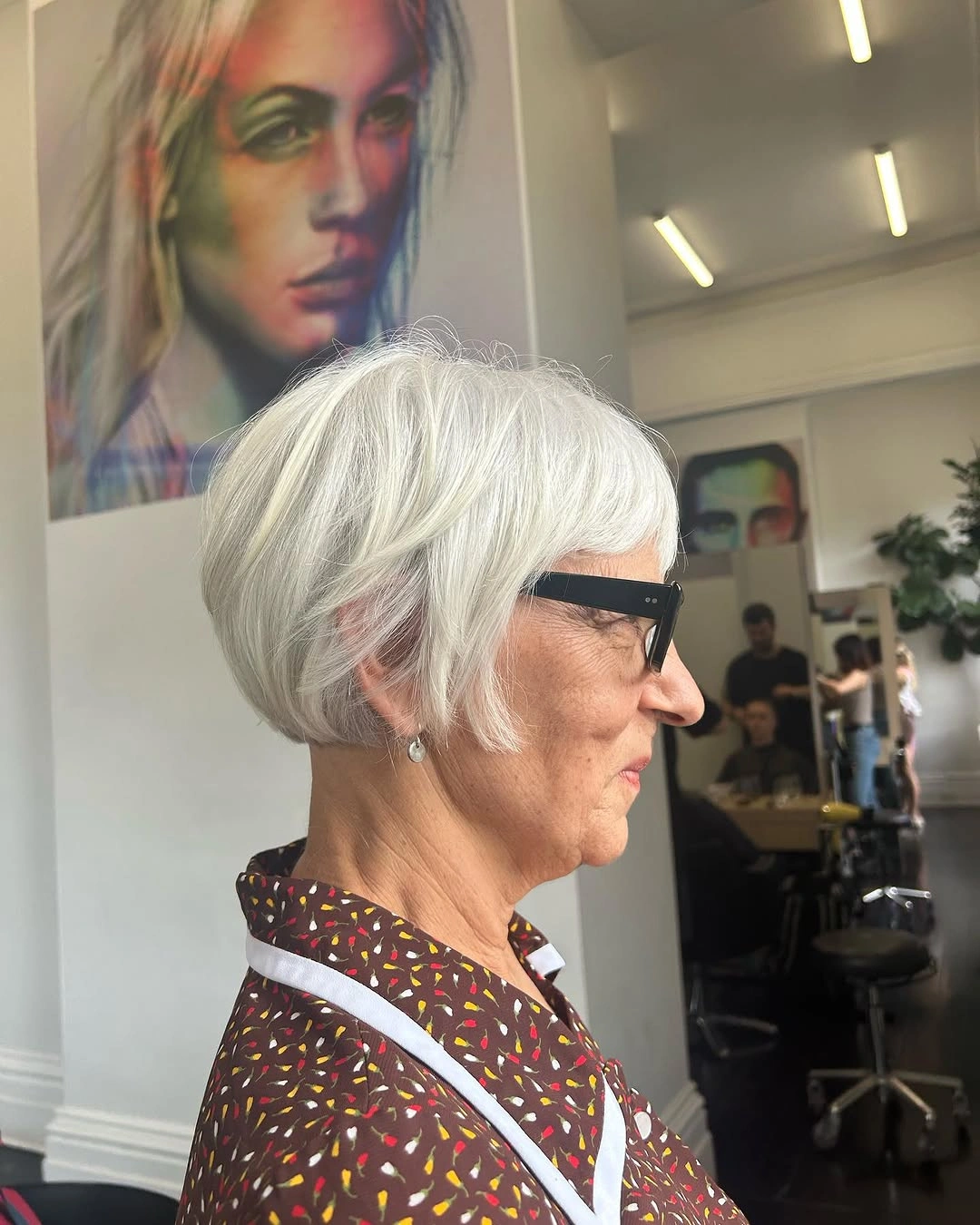 beautiful and trendy haircuts for women over 50 2027 White Layered Bob With Soft Bangs