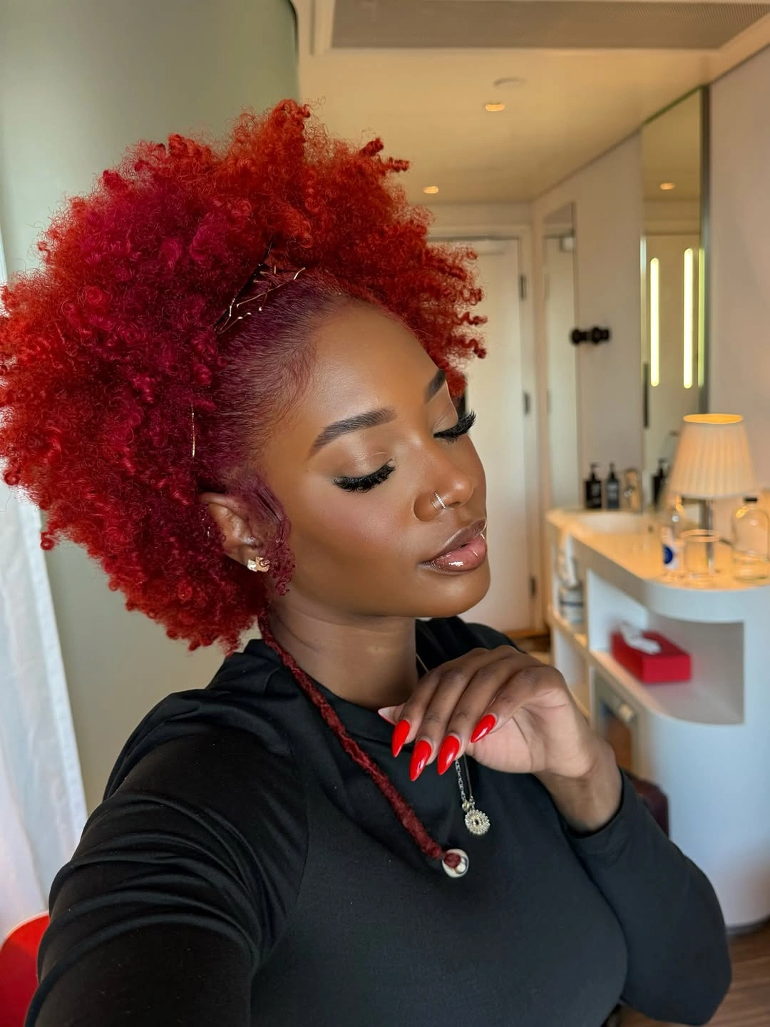 beautiful winter hair color for black women Fiery Red Coils With a Bold Winter Attitude