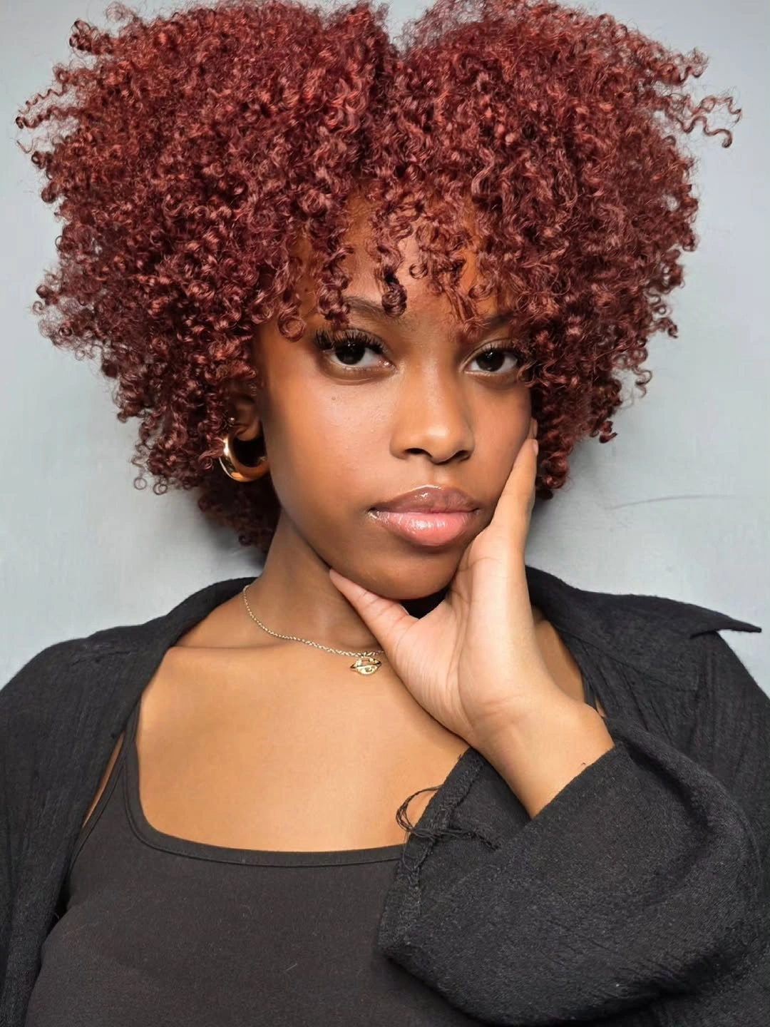 beautiful winter hair color for black women Berry Red Curls With Romantic Winter Depth