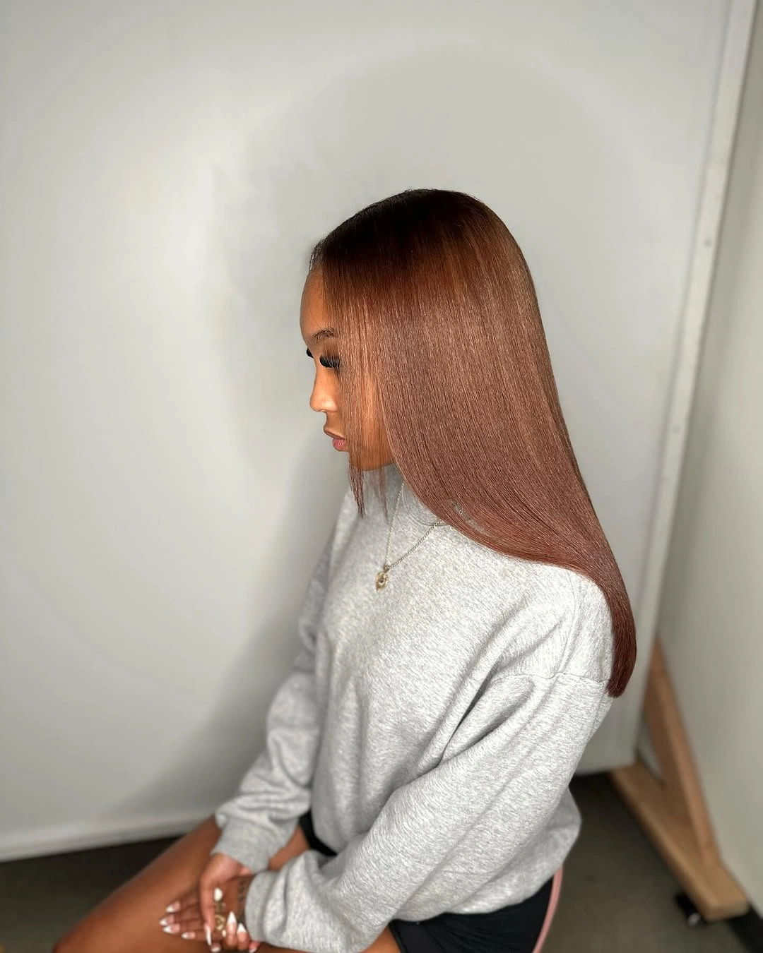 beautiful winter hair color for black women Glossy Brown Lengths for a Sleek Winter Finish
