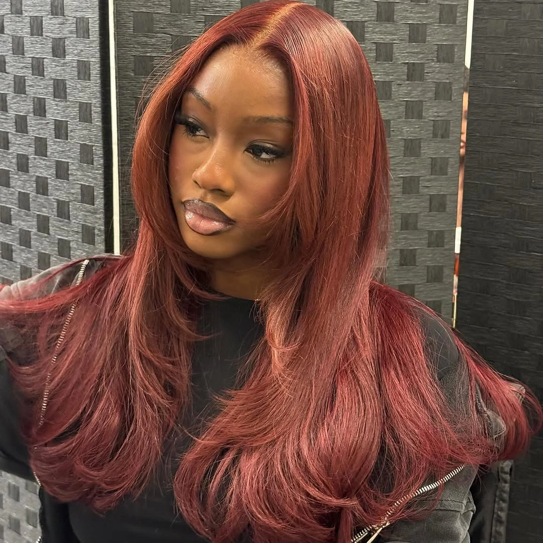beautiful winter hair color for black women Copper Red Layers With Soft Face-Framing Movement