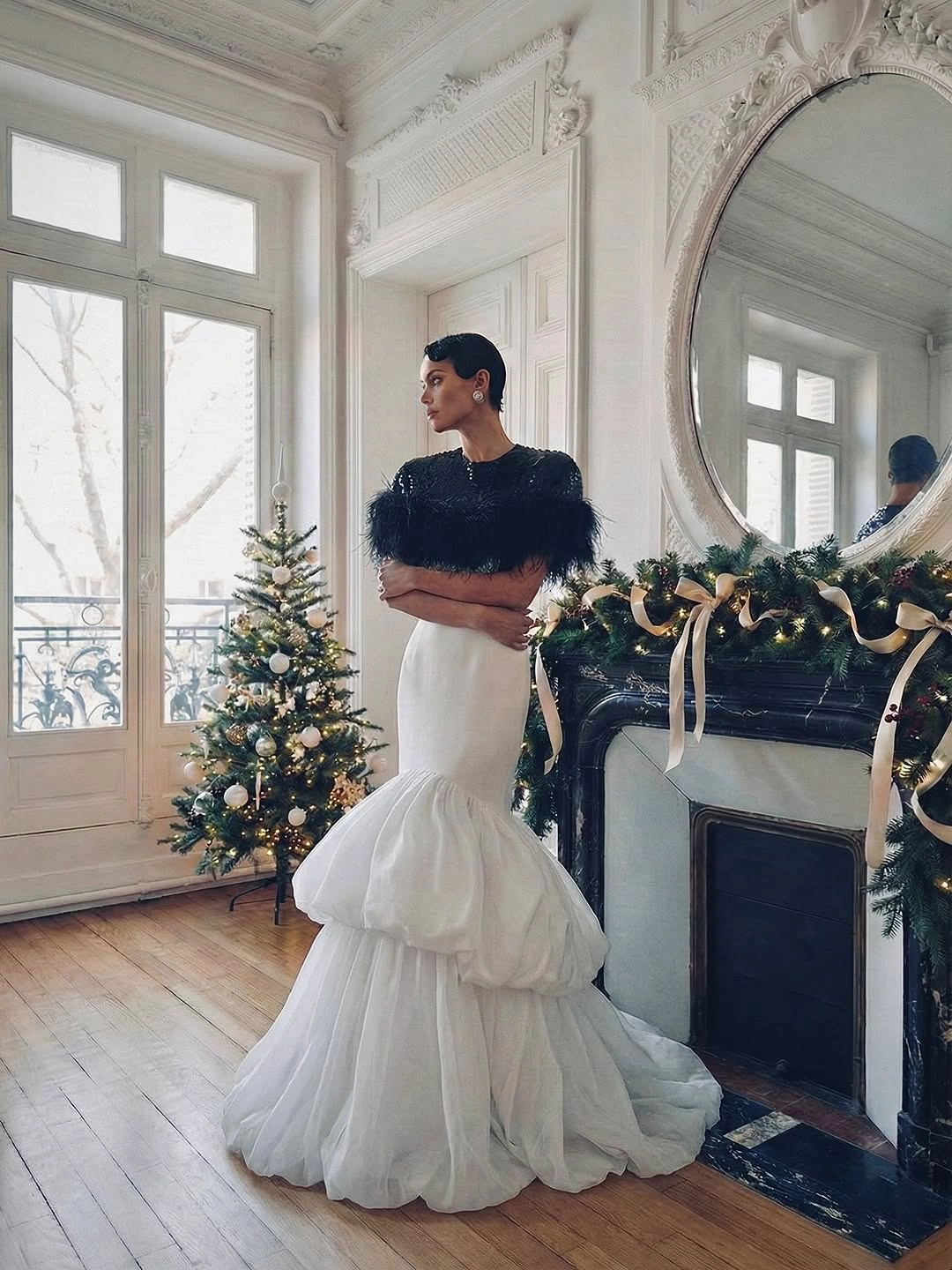 chic christmas outfits 2026 Black Feathers and White Volume for a Modern Holiday Statement