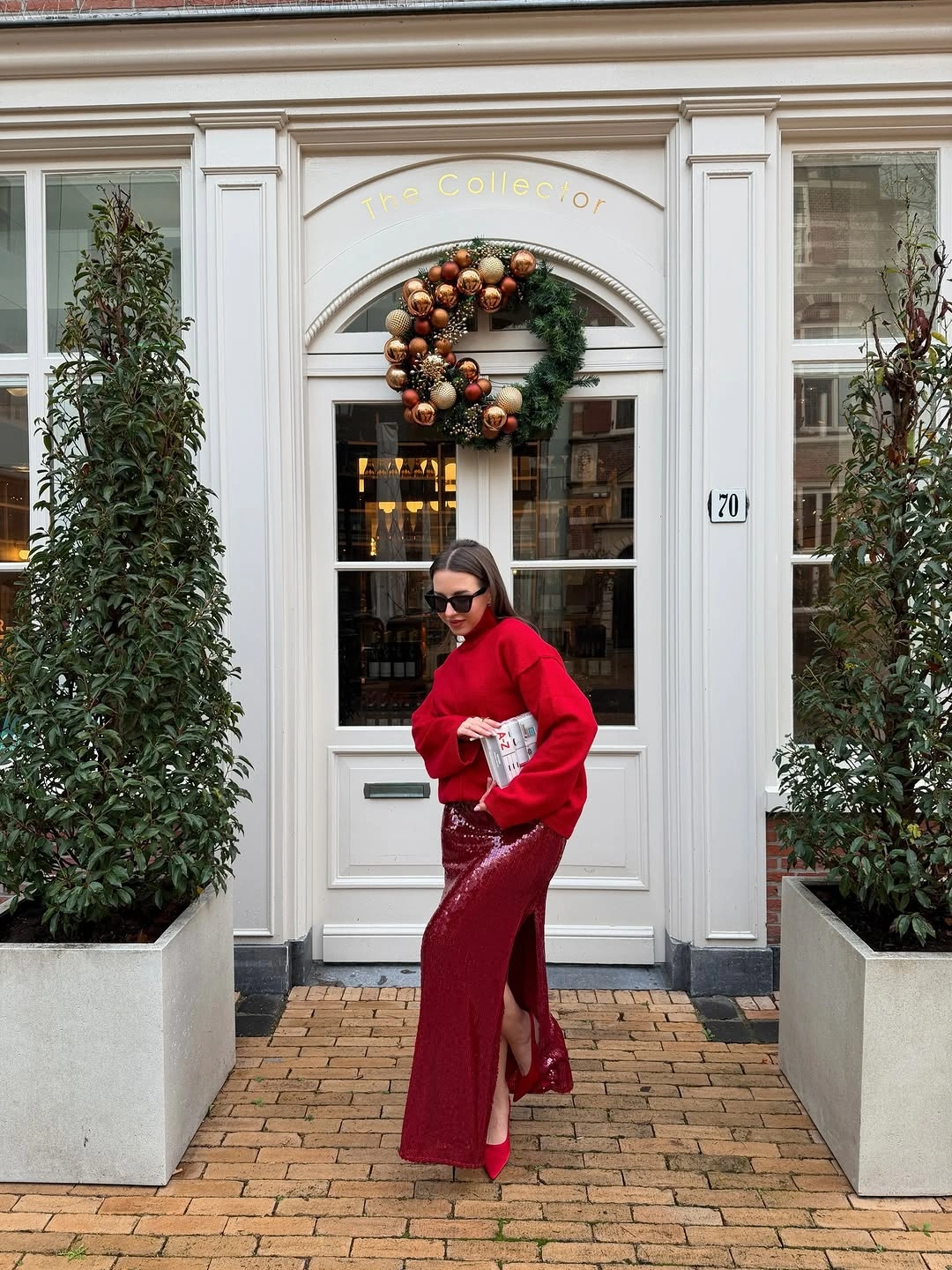 chic christmas outfits 2026 Red Sweater And Sequin Skirt For Modern Holiday Glamour