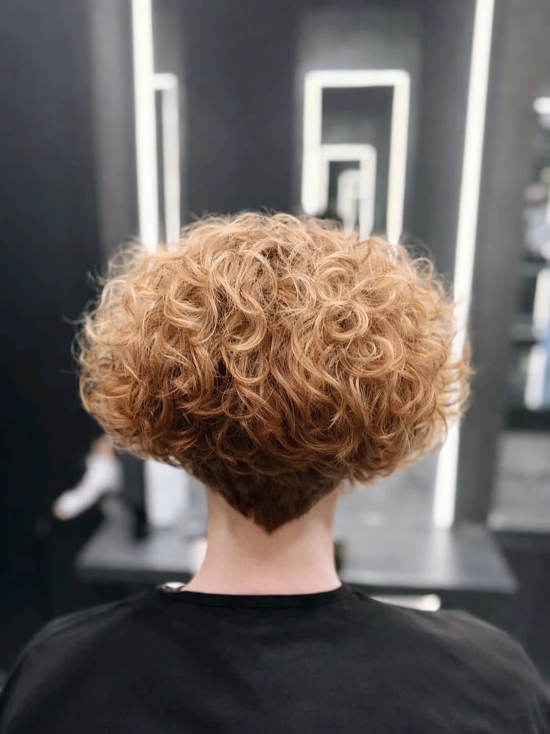 chic curly bob hair Golden Curls With a Tapered Back