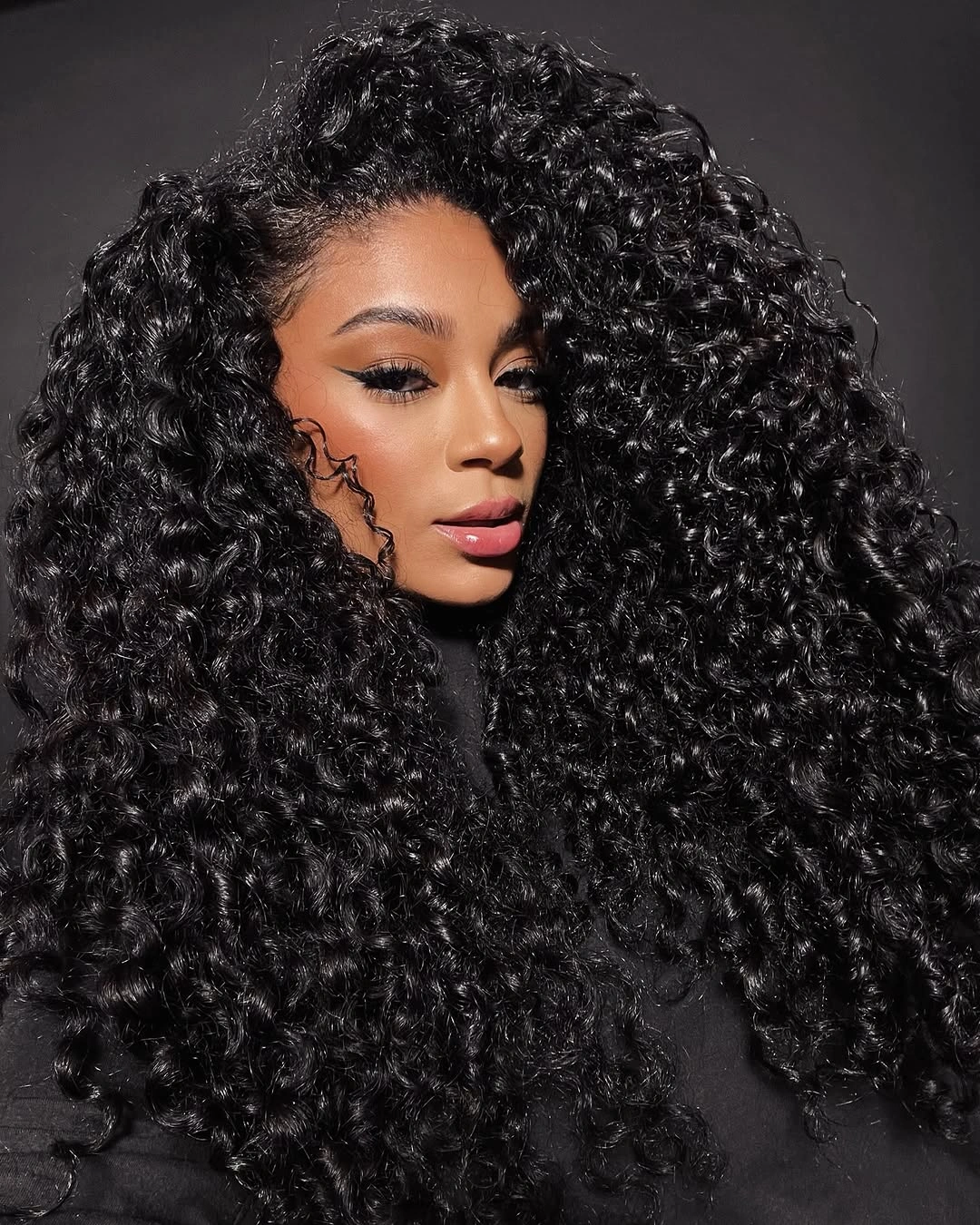chic hairstyle ideas for black women 2027 Glossy Defined Curls With Dramatic Volume