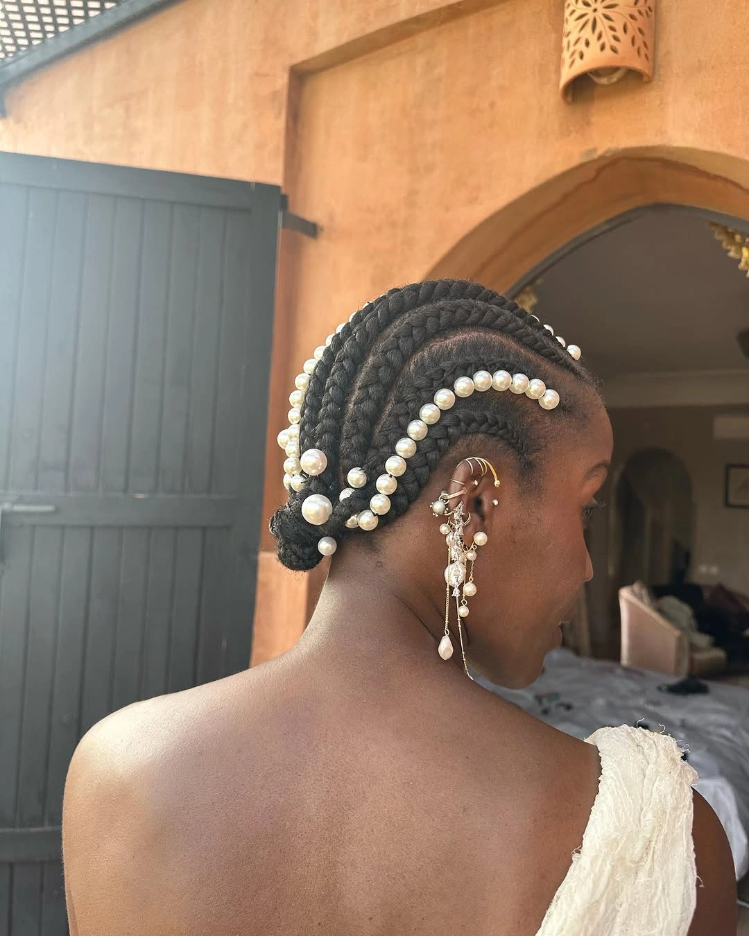 chic hairstyle ideas for black women 2027 Pearl Adorned Cornrow Bun