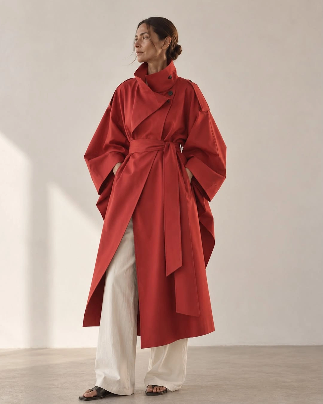 chic & trendy coats 2027 - Chic red wrap coat with sculptural silhouette