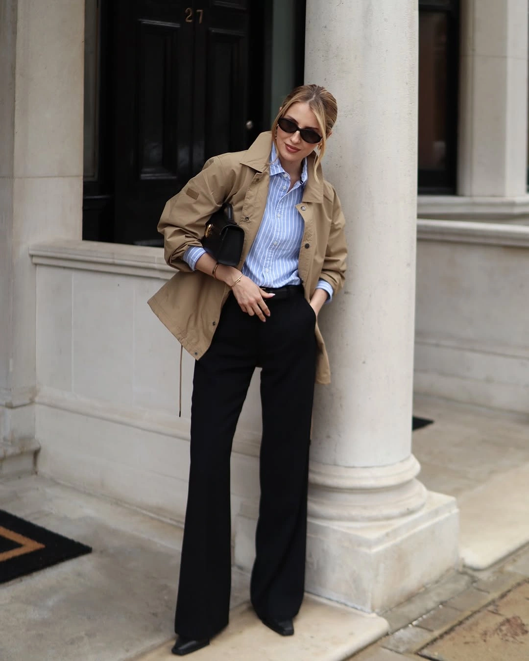 chic winter business casual outfits Blue Stripes and Black Trousers With a Classic Field Jacket