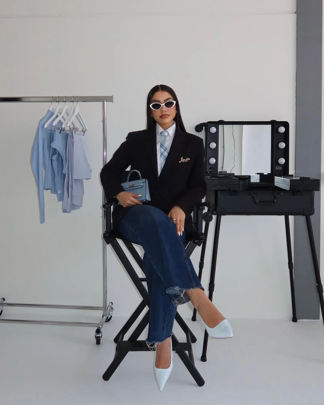 chic winter business casual outfits Black Blazer, Blue Jeans, and a Playful White Heel