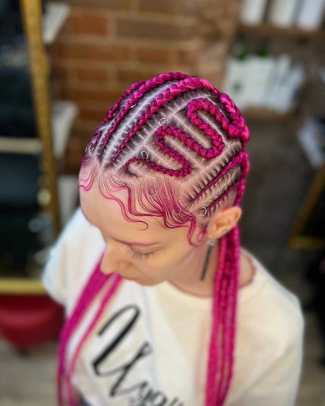 colorful braids for women Hot Pink Cornrows With Graphic Patterns