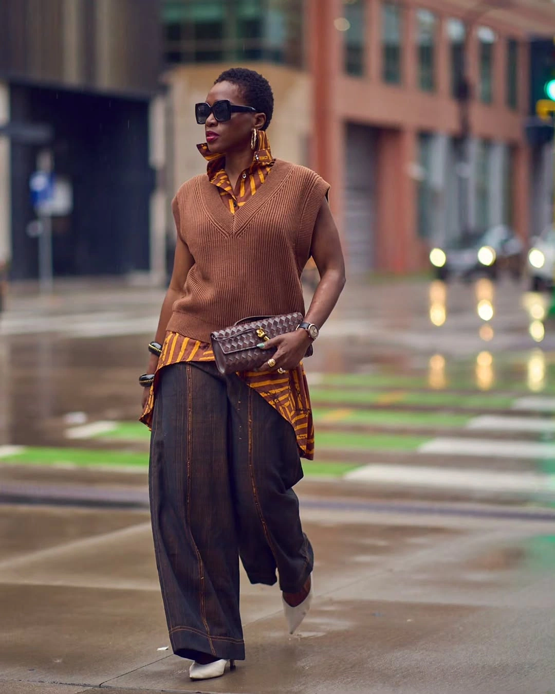 cozy november outfits ideas 2026 Brown Knit Vest and Printed Layers for a Cozy City Statement