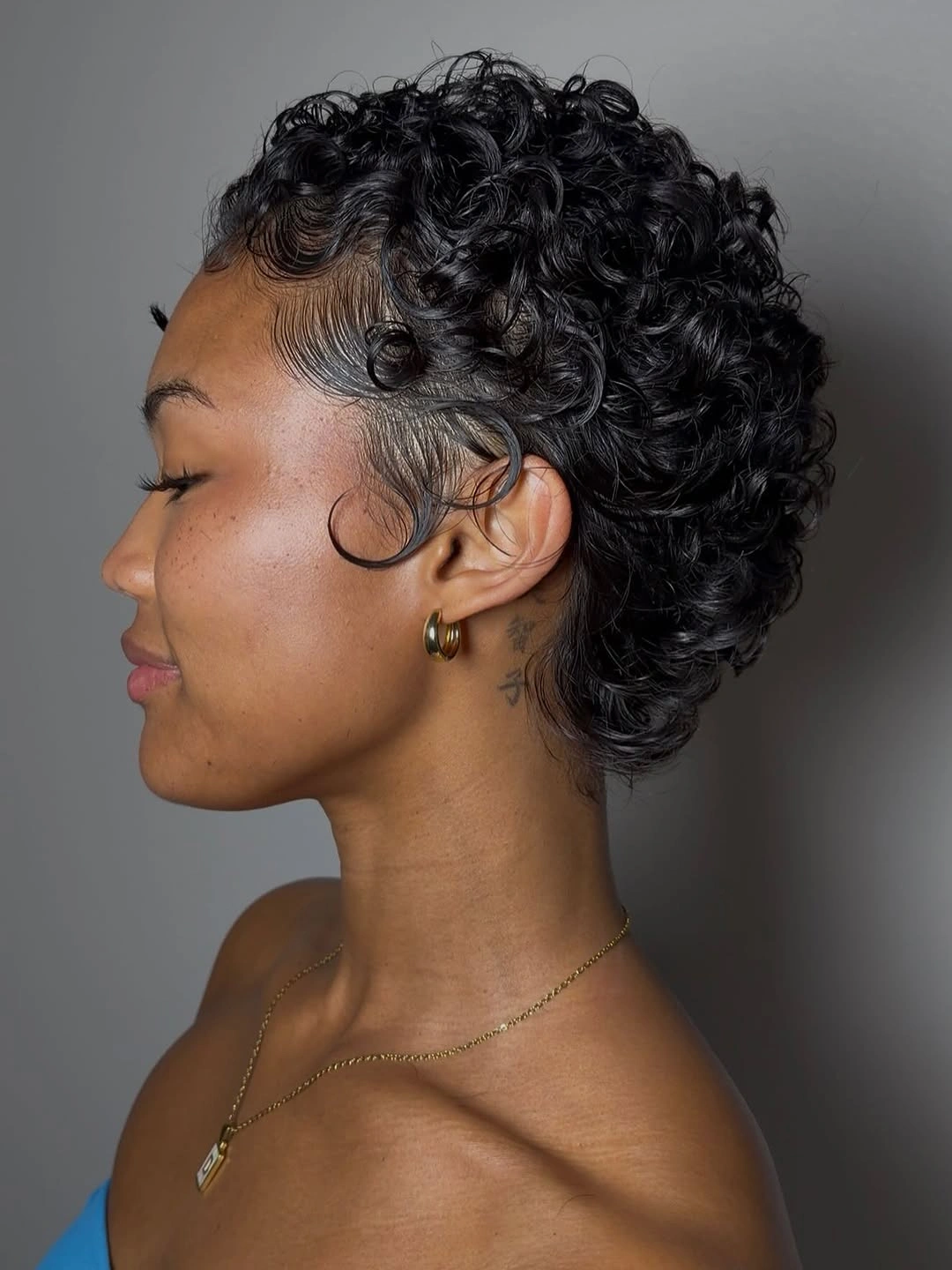 curly pixies haircut Tapered Curly Pixie With Sculpted Edges