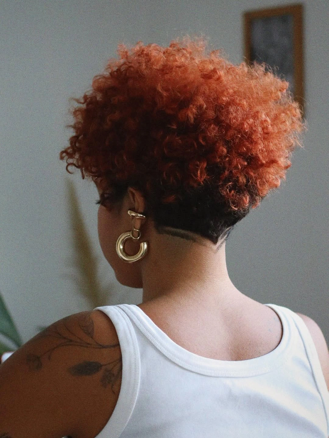 curly pixies haircut Red Curly Pixie With A Bold Undercut