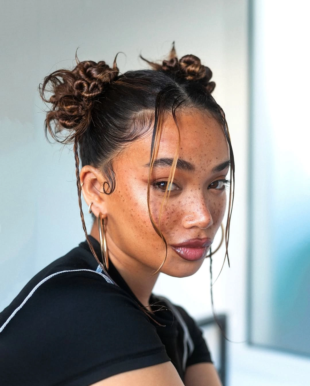 cute braid hairstyle for women Mini Bantu Inspired Buns With Face Framing Strands