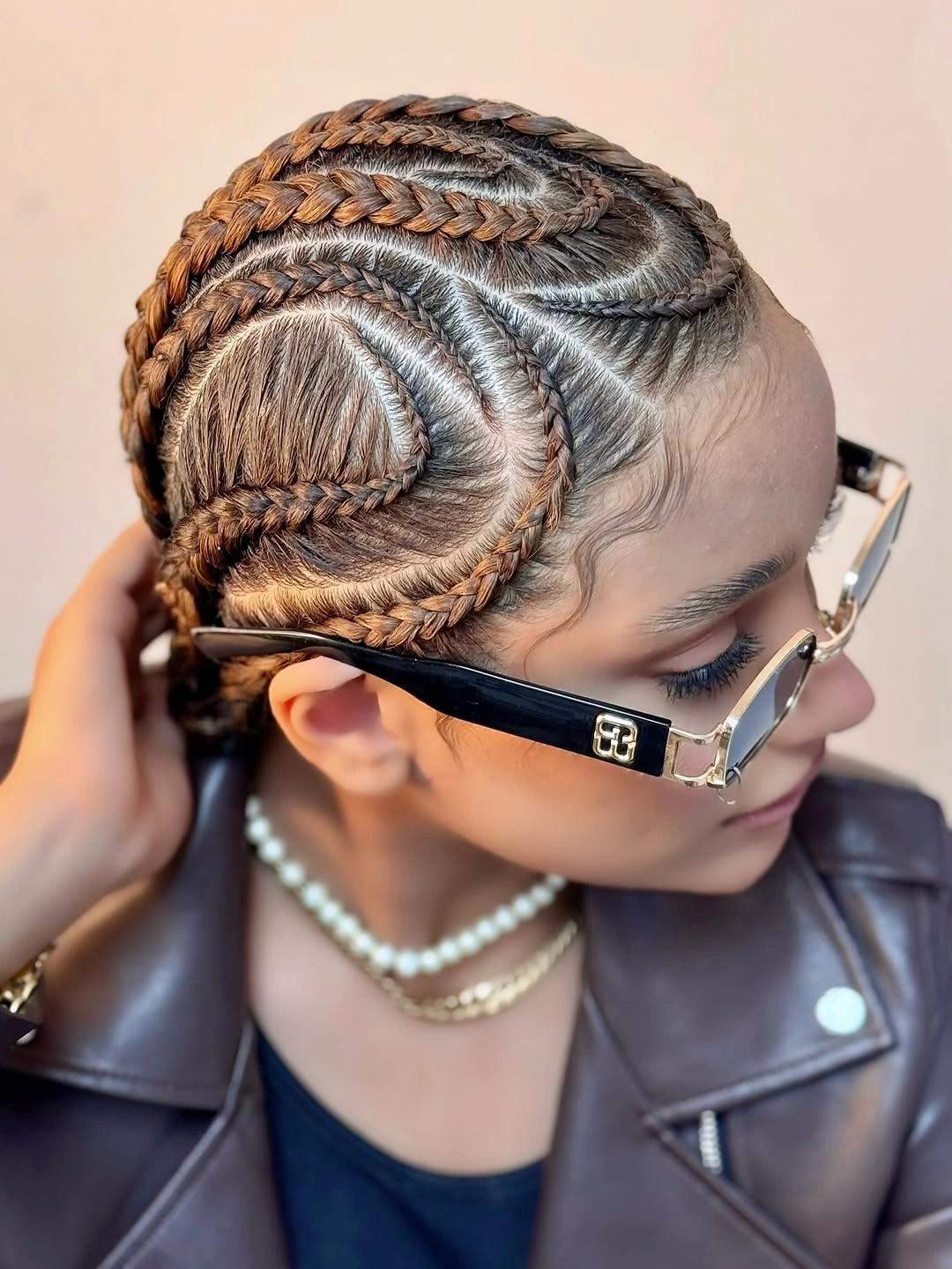 cute braid hairstyle for women Curved Cornrows With Warm Brown Dimension