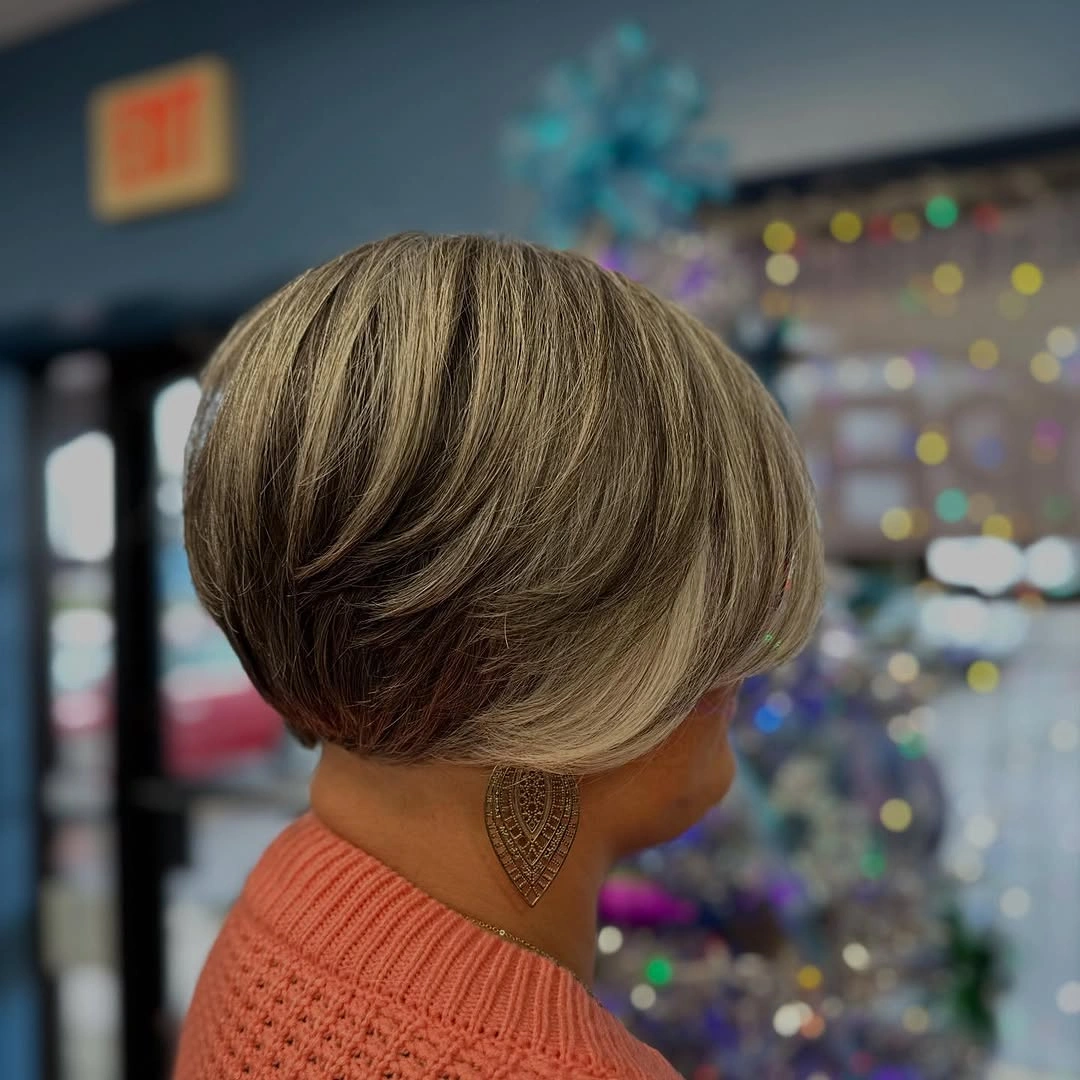 elegant and trendy haircuts for women over 40 2027 Sculpted Blonde Stacked Bob