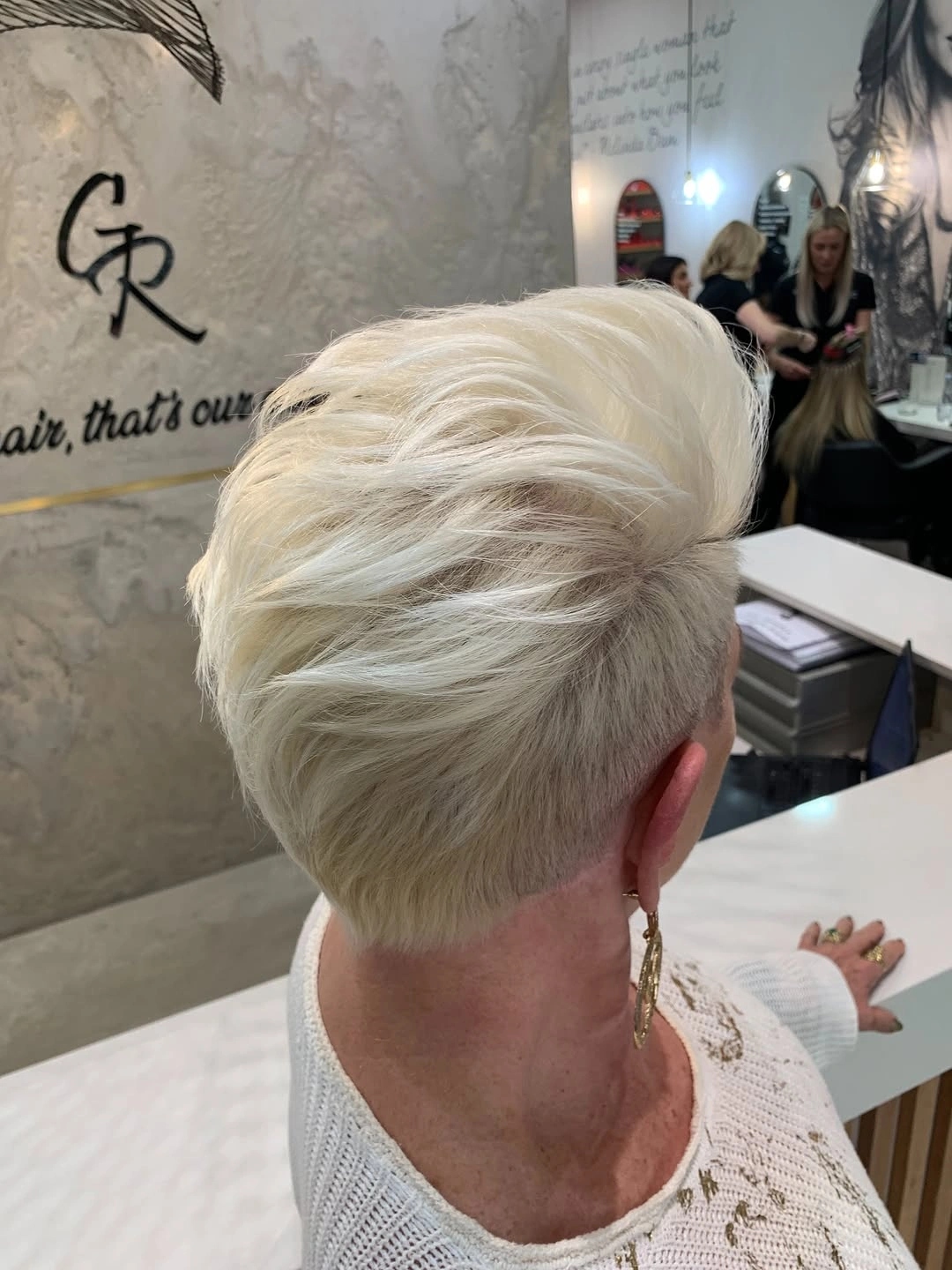 elegant and trendy haircuts for women over 40 2027 Platinum Undercut Pixie