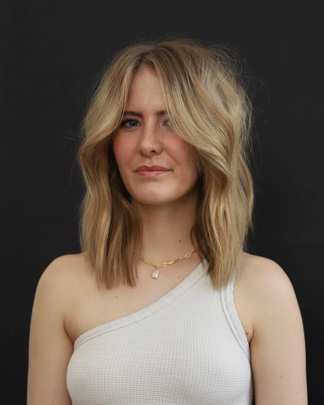 elegant and trendy haircuts for women over 40 2027 Golden Blonde Mid Length Cut