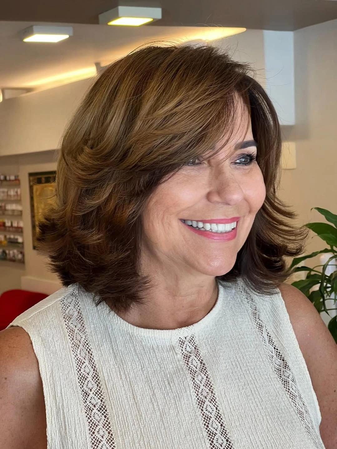 elegant and trendy haircuts for women over 40 2027 Chocolate Layers with Sweeping Bangs