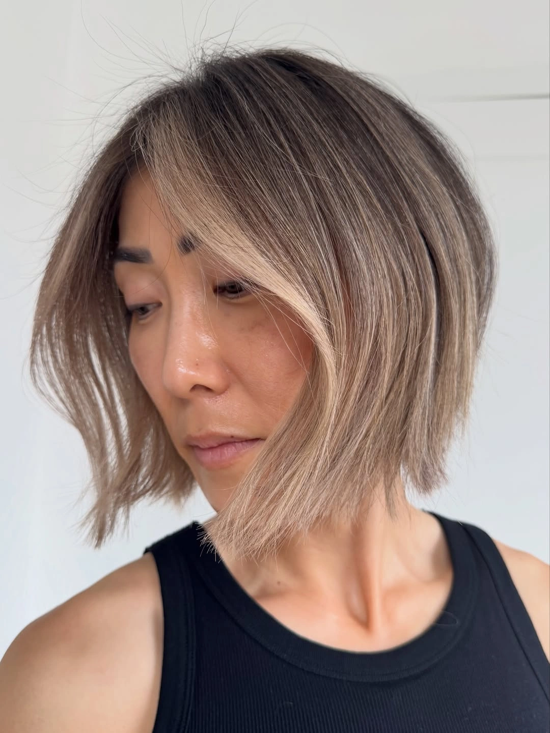 elegant and trendy haircuts for women over 40 2027 Champagne Blunt Bob