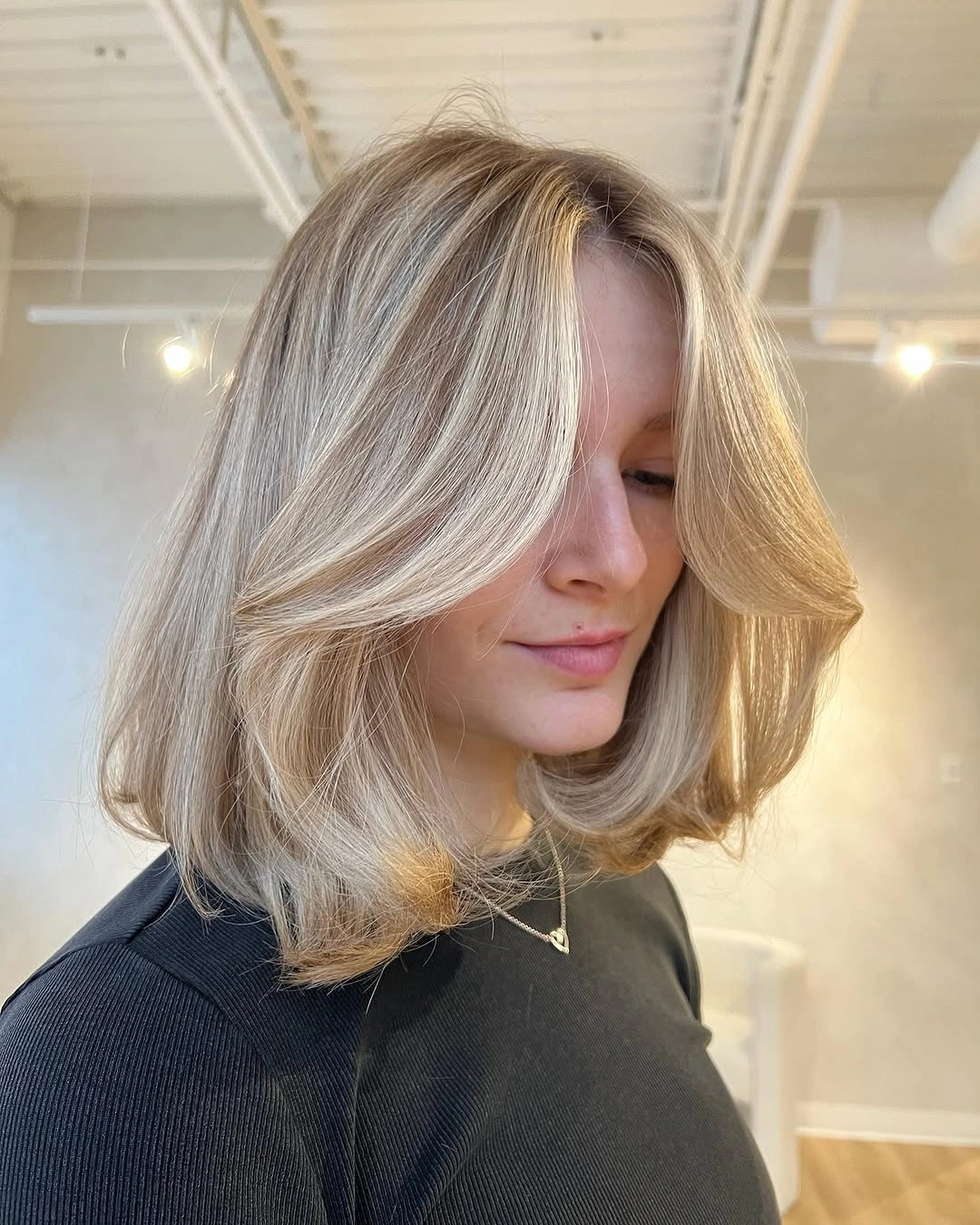 flattering lob haircut - Blonde Lob With Voluminous Curtain Bangs