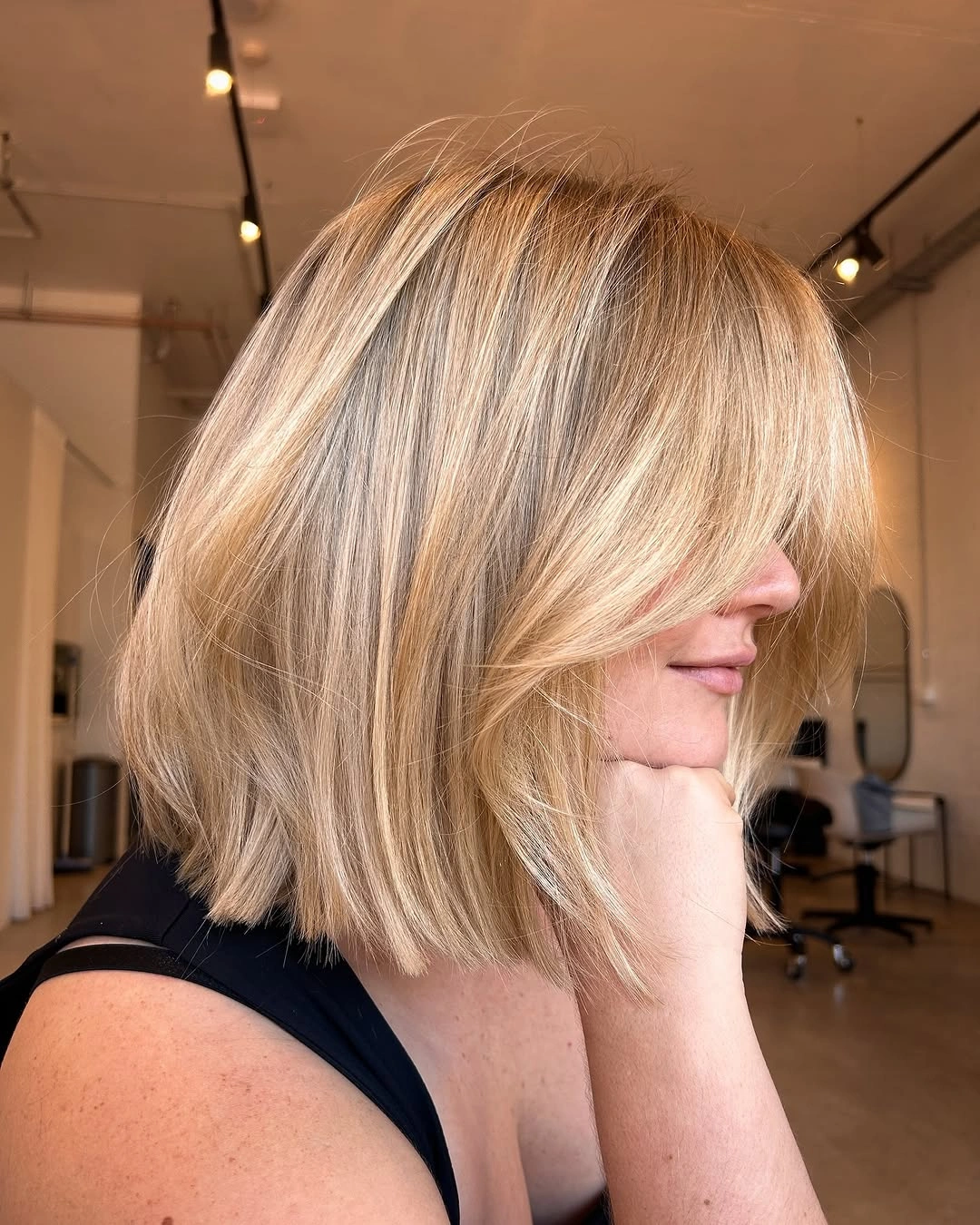 flattering lob haircut - Softly Shaggy Lob With Long Side-Swept Bangs