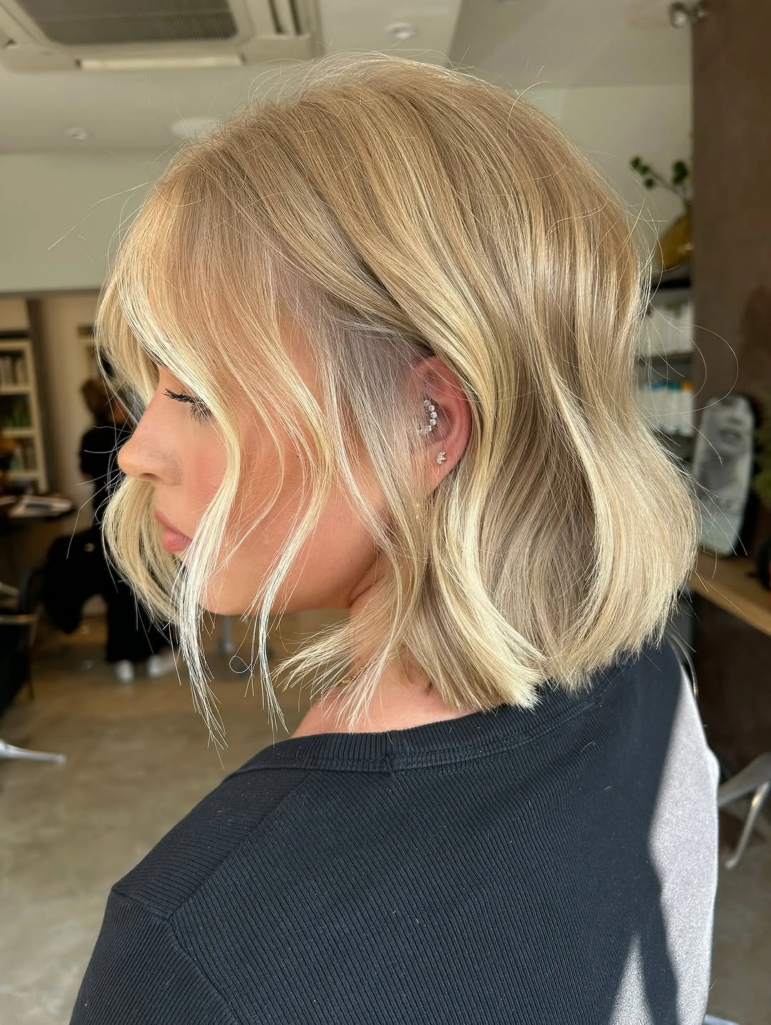 flattering lob haircut - Layered Blonde Lob With Side-Swept Movement