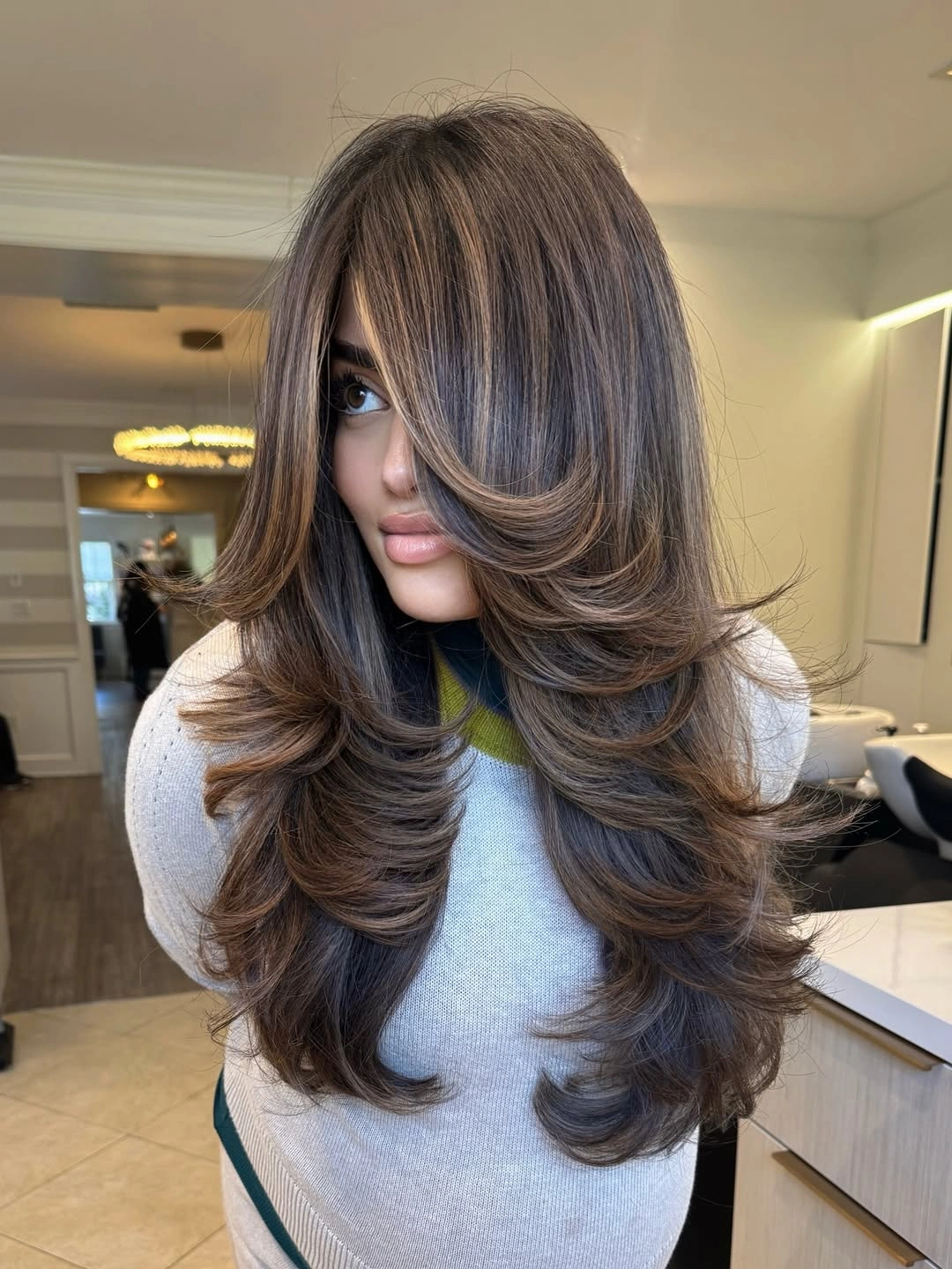 flattering november haircut ideas 2026 - Long Feathered Layers With a Soft Curtain Fringe