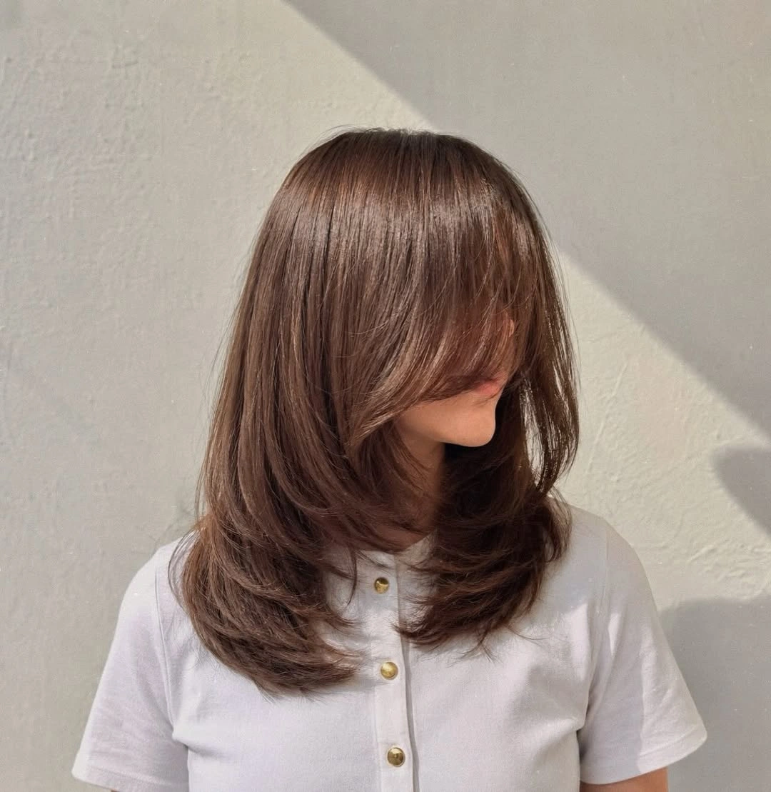 flattering november haircut ideas 2026 - Soft Long Layers With Curtain Fringe
