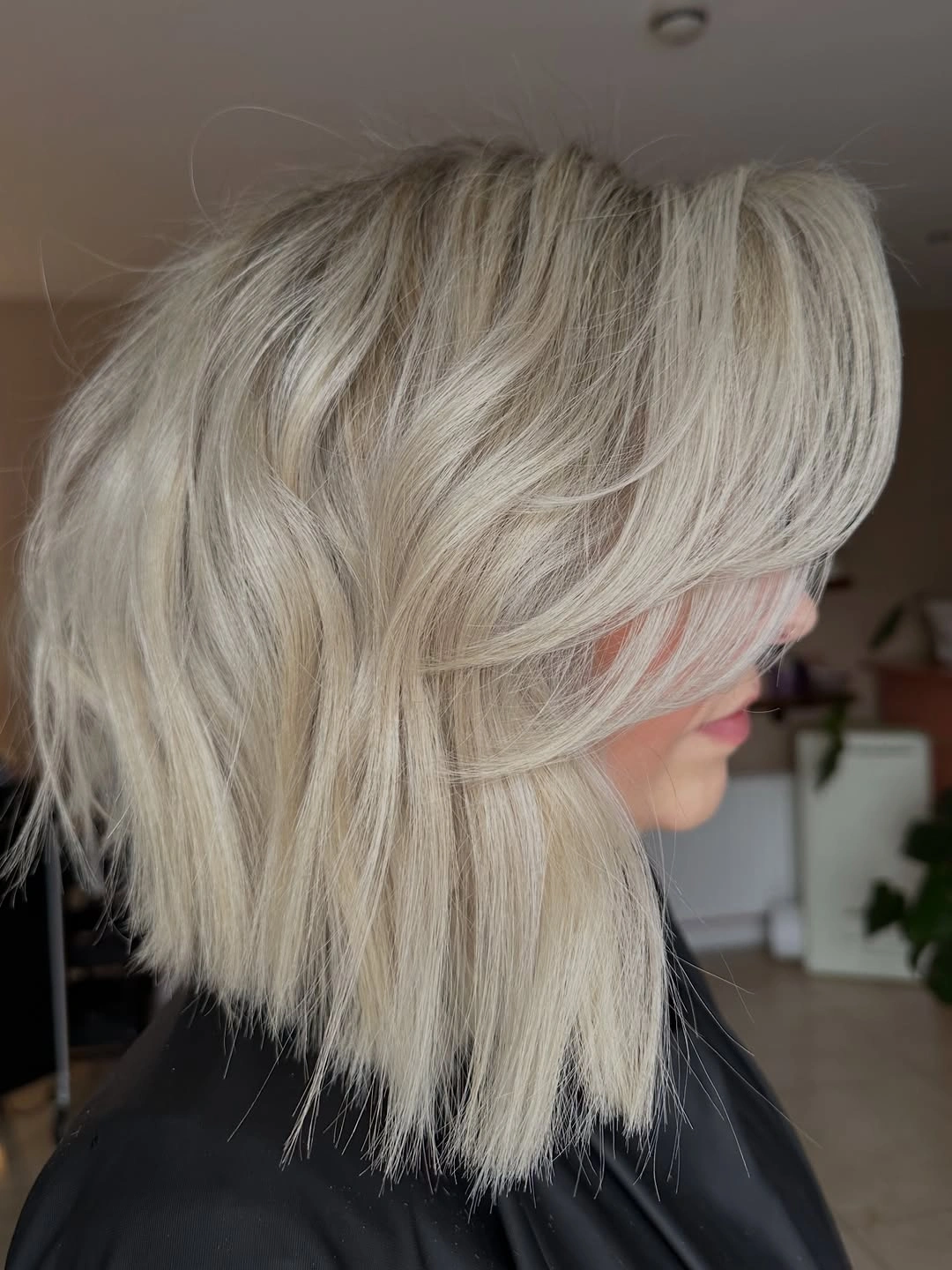 flattering november haircut ideas 2026 Airy Blonde Layers With a Feathered Finish