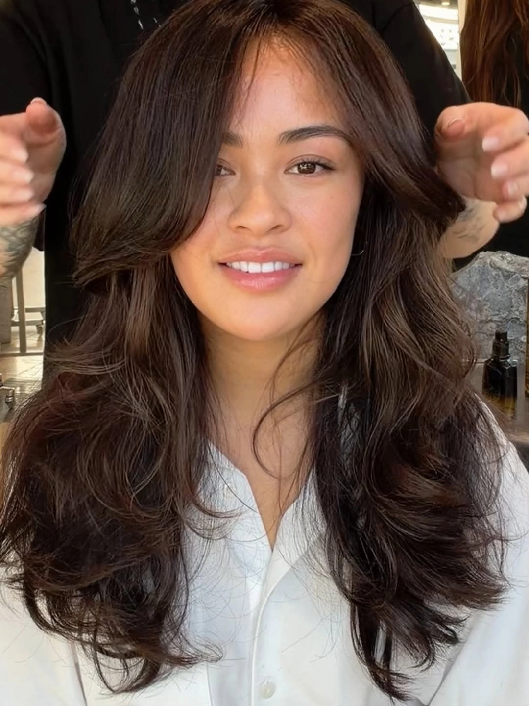 flattering november haircut ideas 2026 - Face-Framing Brunette Layers With Airy Bangs
