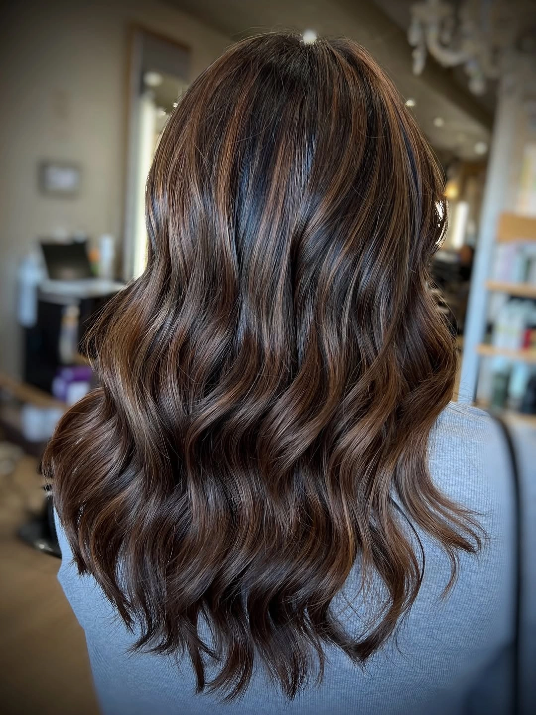 flattering november haircut ideas 2026 - Glossy Chocolate Waves With Layered Movement