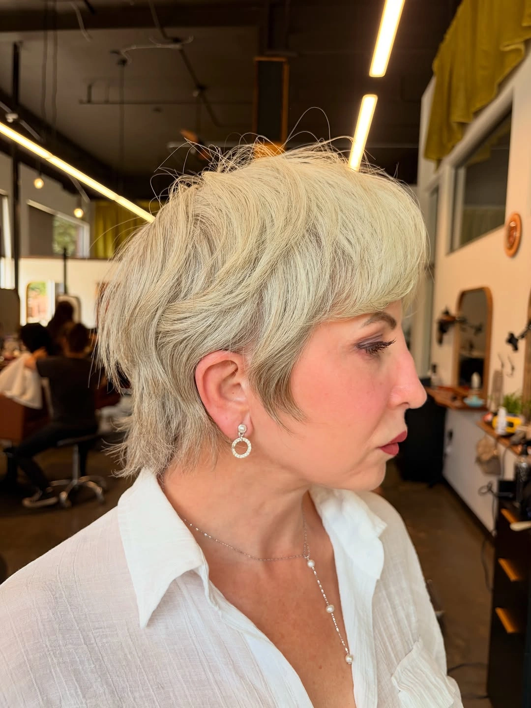 flattering winter haircuts for plus size women - Silver Pixie With Soft Volume